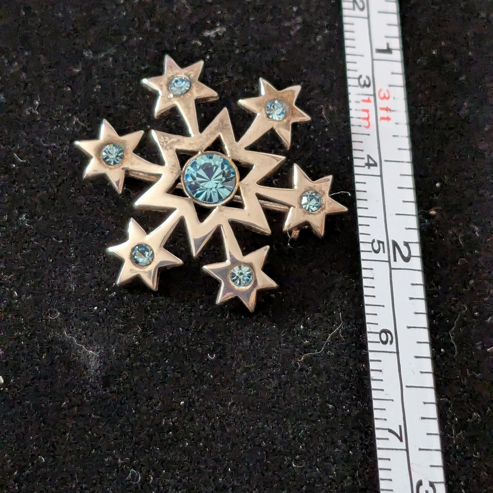 Silver Starburst Brooch with Blue Accents